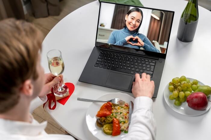 Virtual video call between two smiling partners, showcasing the importance of communication in long-distance relationships